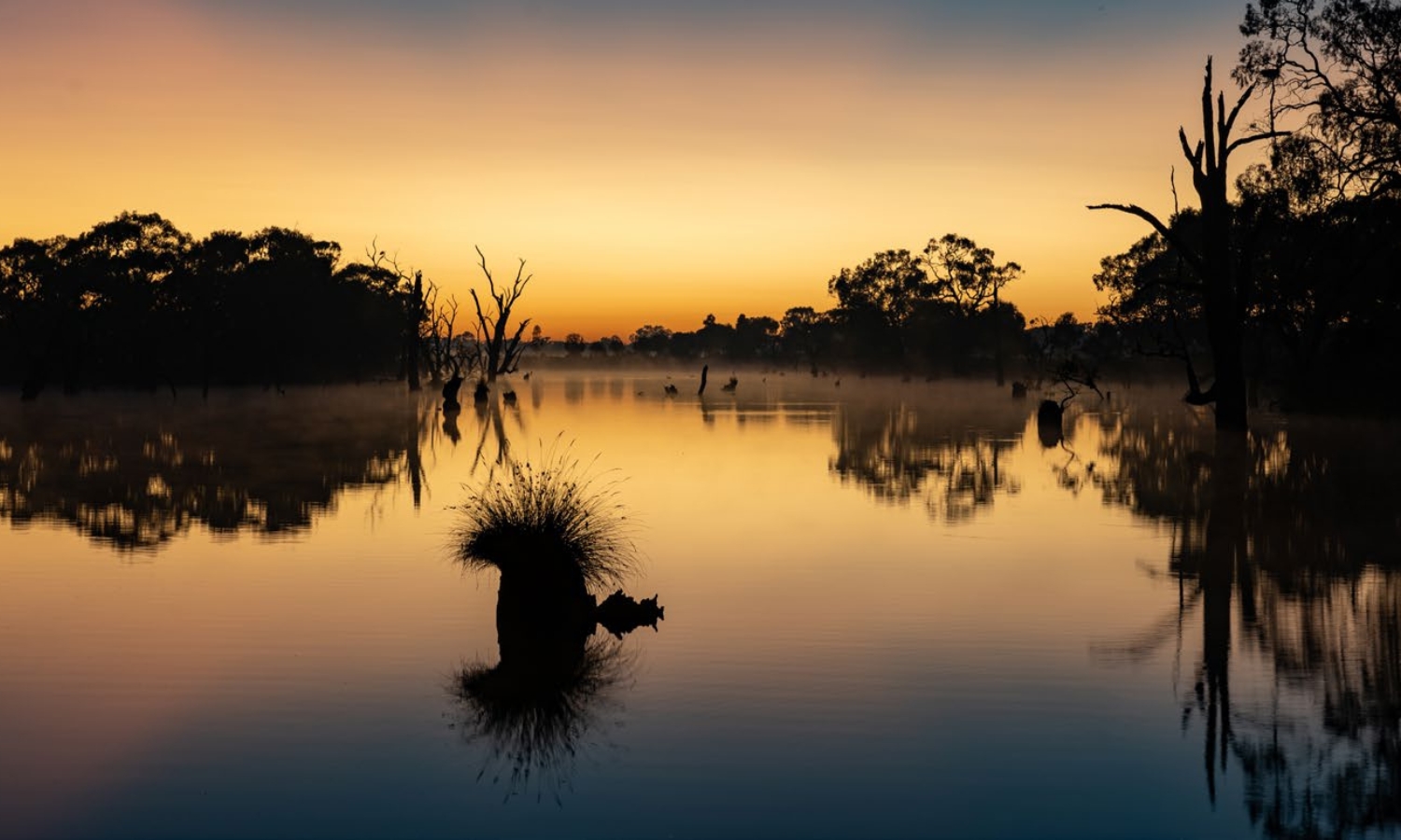 Photo of lake at sunset