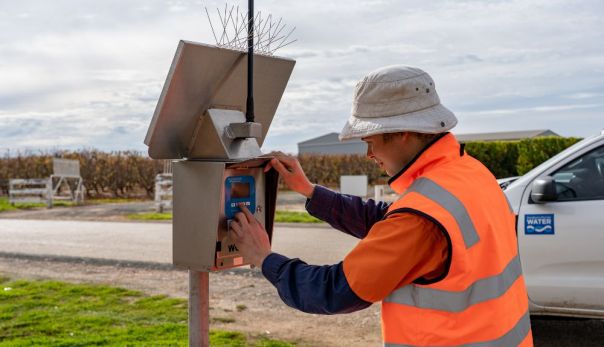 Photo of water corporation field officer telemetry device on rural property in Northern Victoria